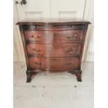 Good quality Edwardian serpentine chest the brushing slide above three long drawers raised on
