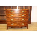19th. C. mahogany bow fronted chest with four graduated long drawers raised on splay feet { 86cm H X