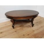 Mahogany coffee table the oval top raised on platform base with cabriole legs { 44cm H X 104cm W X