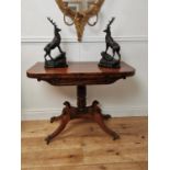 Good quality Regency mahogany turn over leaf tea table raised on turned column and four outswept