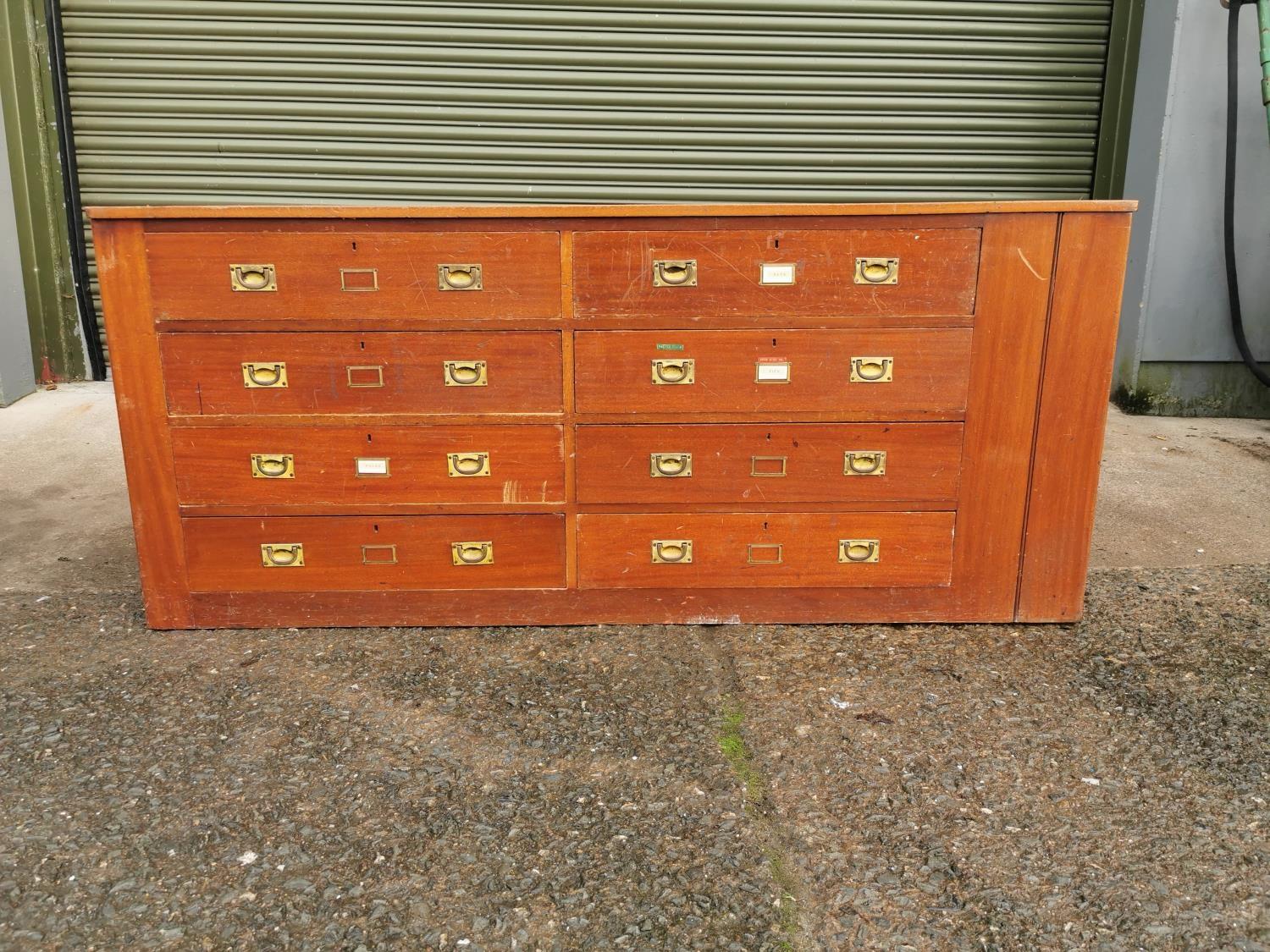 Early 20th C. mahogany haberdashery cabinet with eight drawers and brass handles {84 cm H x 194 cm W