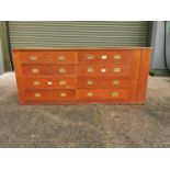 Early 20th C. mahogany haberdashery cabinet with eight drawers and brass handles {84 cm H x 194 cm W