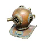 Brass and copper diver's helmet { 38cm H X 46cm W X 41cm D }.