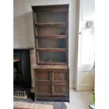 Pair of 1940s oak stackable book cases with four glazed doors above four panelled doors {231 cm H