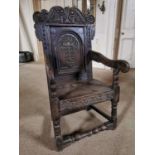 18th C. carved oak throne chair raised on turned legs and single turned stretcher {114 cm H x 60