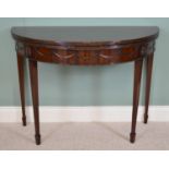 19th C. mahogany demi - lune turn over leaf games table raised on square tapered legs and spade feet