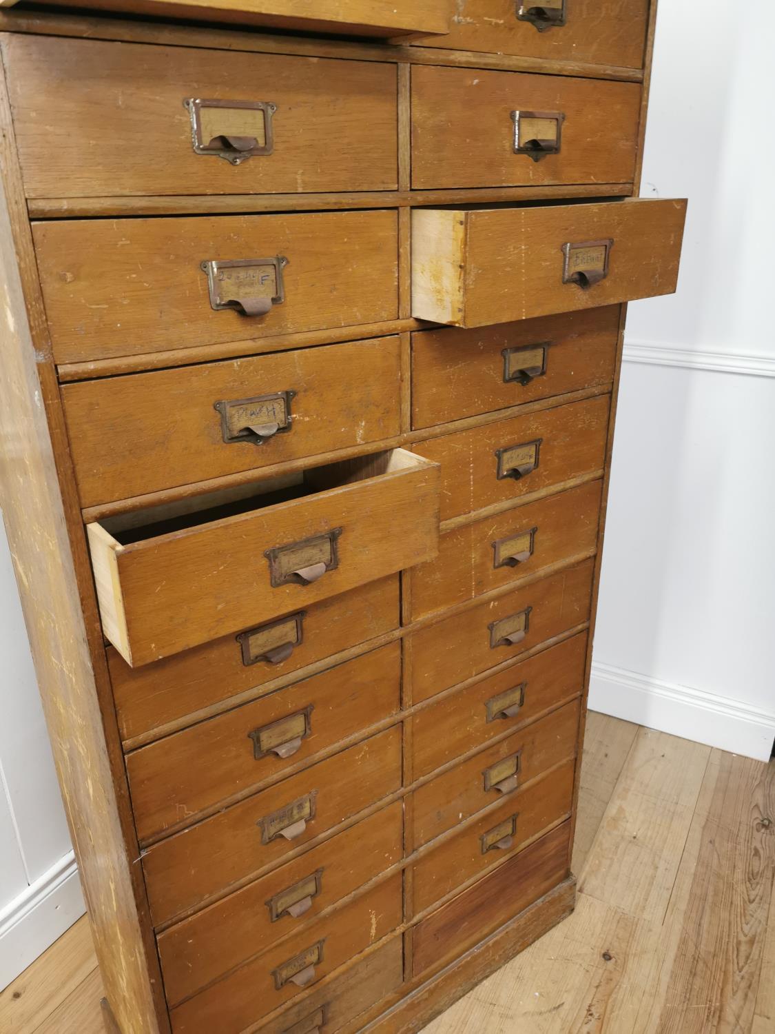 Early 20th. C. painted pine bank of twenty five short drawers with original handles, raised on - Image 7 of 7