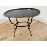 Early 20th C. wrought iron lamp table on four outswept feet. {43 cm H x 53 cm W x 38 cm D}.