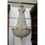 Large cut glass and brass six lamp chandelier decorated with floral and mask motifs { 120cm H X 60cm