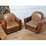 Pair of leather upholstered club chairs raised on tapered feet {87 cm H x 86 cm W x 80 cm D}.