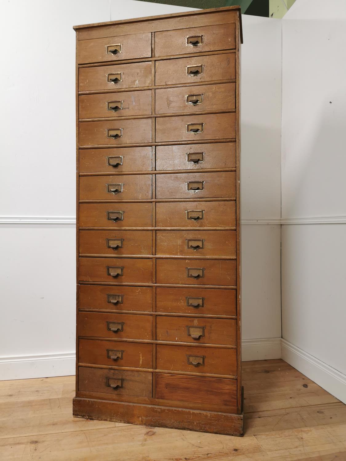 Early 20th. C. painted pine bank of twenty five short drawers with original handles, raised on - Image 4 of 7