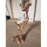 Early 20th C. model of a taxidermy stoat chasing a red squirel on branch {145 cm H x 68 cm W x 34 cm
