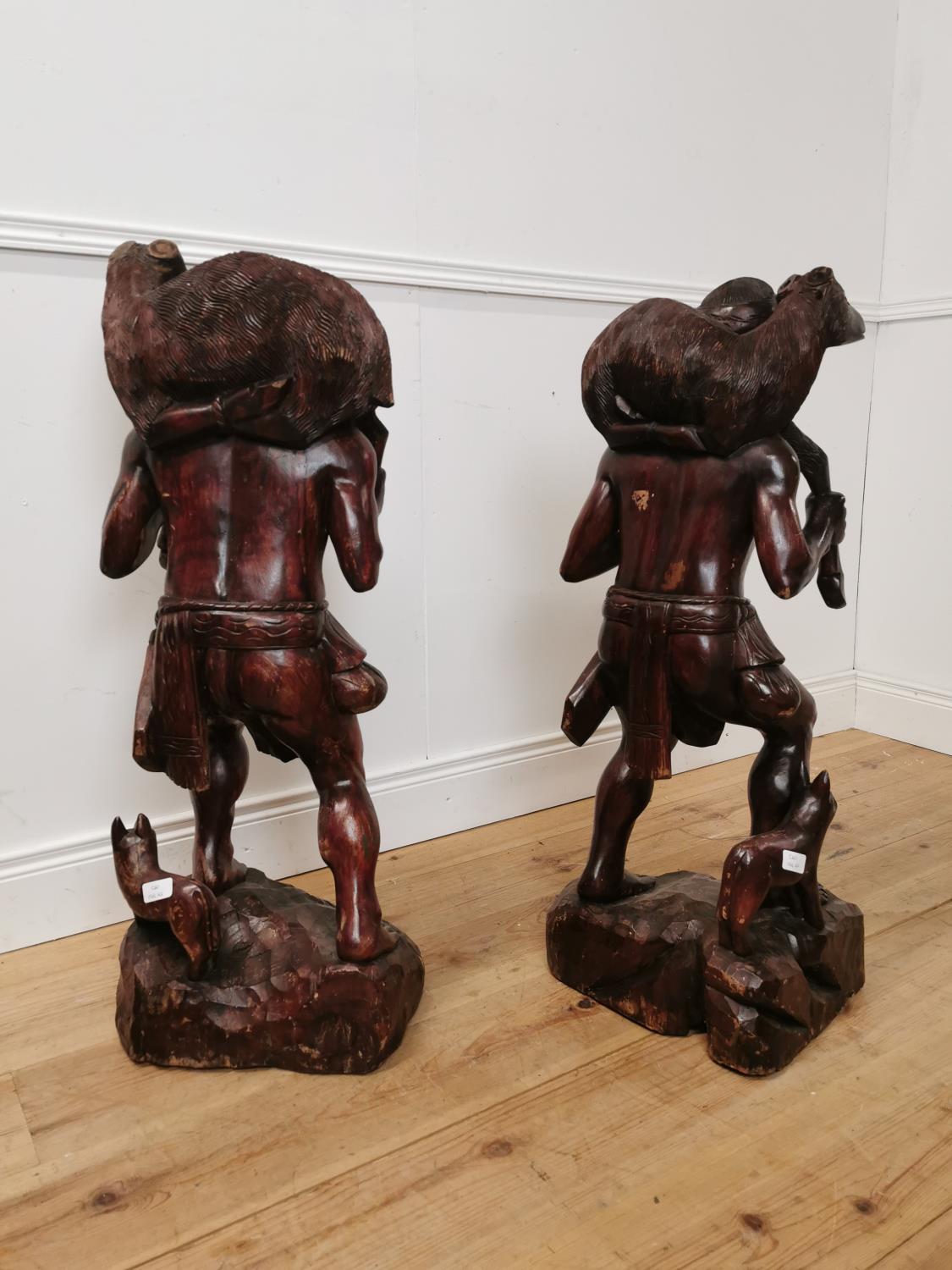 Pair of carved hardwood figures of Hunters. { 10cm H X 36cm W X 30cm D }. - Image 3 of 3