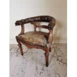 19th C. upholstered leather carved oak desk chair decorated with lions masks raised on turned