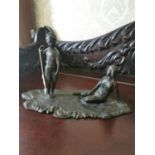 Bronze figural group of a Boy and Girl mounted on a wooden plinth {23 cm H x 36 cm W x 18 cm D}.