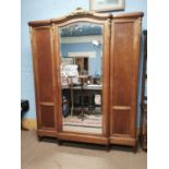 19th. C. mahogany robe with single mirrored door and ormulo mounts raised on tapered legs { 237cm