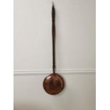 Early 20th. C. copper bed warmer { 117cm H X 30cm W X 10cm D }.