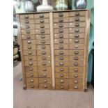 Early 20th. C. scumbled pine bank of fifty six drawers { 188cm H X 163cm W X 39cm D }.