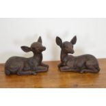 Pair of cast iron models of seated Fawns { 27cm H X 33cm W }.