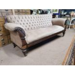 William IV carved mahogany upholstered sofa raised on turned legs with brass casters { 96cm H X