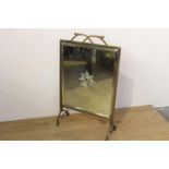 Art Nouveau brass fire screen with bevelled mirrored plate { 65cm H X 39cm W X 17cm D }.