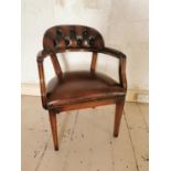 Mahogany and leather upholstered office chair raised on square tapered legs {84 cm H x 60 cm W x
