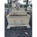 Good quality moulded stone wall fountain decorated with ivy leaf surmounted with Grecian God