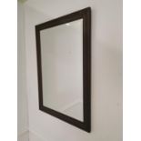 Wall mirror mounted in an oak frame { 86cm H X 60cm W }.