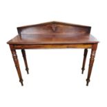 19th. C. mahogany consul table the gallery back decorated with a shield raised on turned tapered