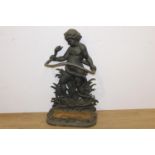 Cast iron stick stand in the form of a Boy and Snake { 80cm H X 50cm W X 30cm D }.