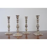 Set of four silver plated candle sticks. { 31cm H X 13cm Sq }