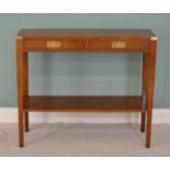 Mahogany console table with brass mounts and two drawers in the frieze raised on square tapered legs