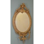 19th. C. gilt wood oval wall mirror with sconces . { 86cm H X 44cm W }.