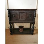 17th C. profusely carved oak court cupboard decorated with winged cherubs and lions masks