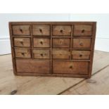 Early 20th. C. pine watch maker's drawers, the twelve short drawers over two deep drawers.. { 23cm H