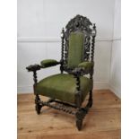 19th. C. upholstered carved oak throne chair the arms terminating in dog's heads { 130cm H X 67cm
