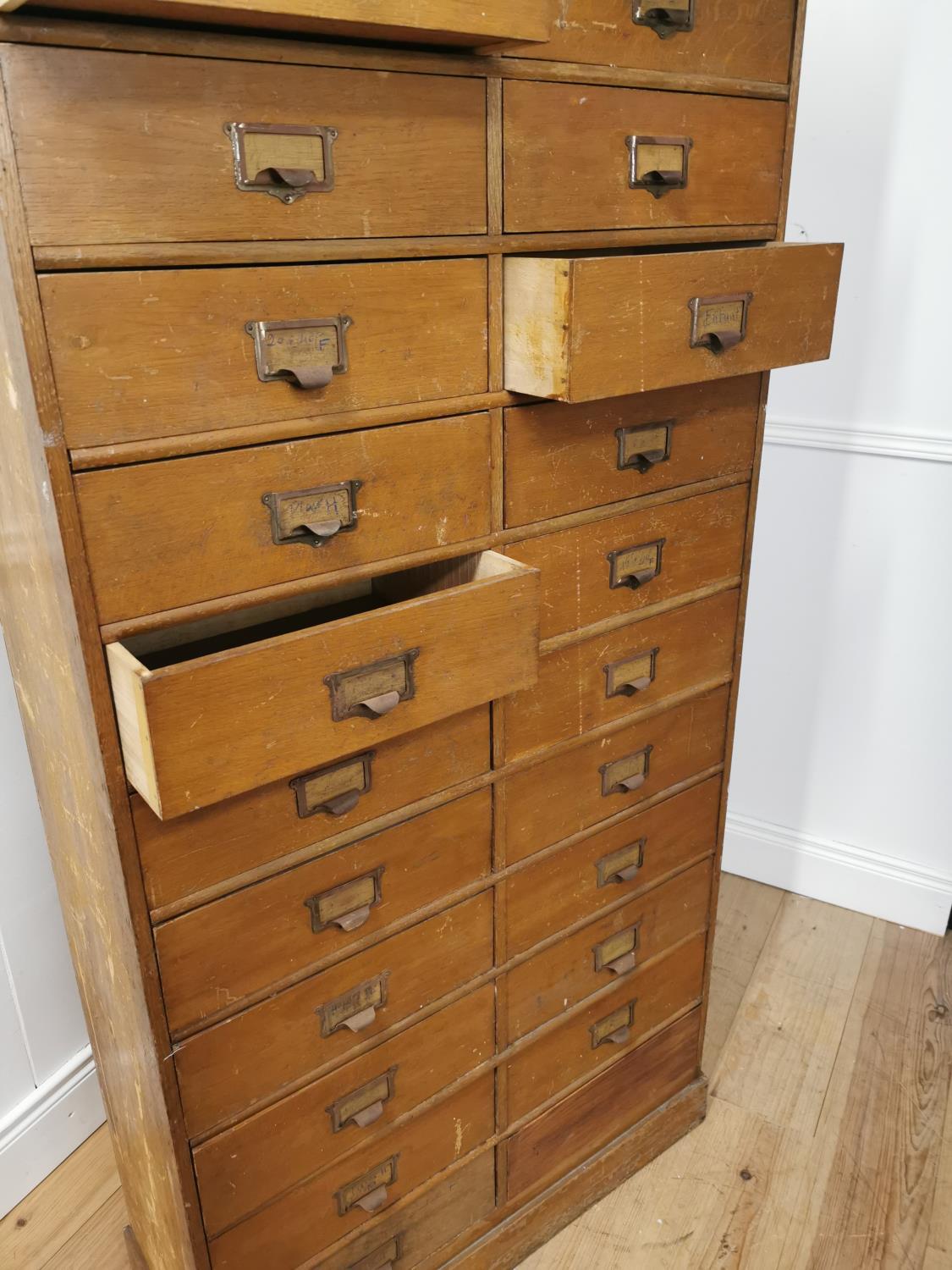 Early 20th. C. painted pine bank of twenty five short drawers with original handles, raised on - Image 6 of 7