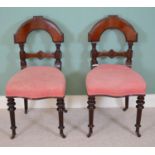 Pair of Regency mahogany hall chairs with upholstered seats, raised on turned tapered legs { 95cm