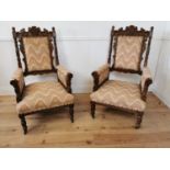Pair of good quality Edwardian oak upholstered armchairs decorated with the Green Man mask. {118
