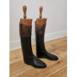 Pair of 19th. C. leather riding boots with wooden trees { 65cm H X 31cm W X 10cm D }.