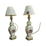 Pair of ceramic and brass table lamps decorated with amorial crests with shades { 44cm H }.