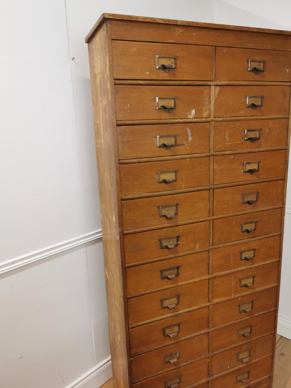 Early 20th. C. painted pine bank of twenty five short drawers with original handles, raised on - Image 5 of 7