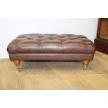 Deep buttoned leather upholstered foot stool { 34cm H X 95cm W X 60cm D }.