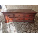 Mahogany coffee table with six short drawers and six opposing short drawers { 43cm H X 117cm W X