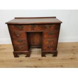 Georgian mahogany knee hole writing desk with a single long drawer over and recessed cupboard
