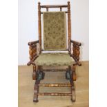 Late 19th. C. American rocking chair with upholstered seat { 103cm H X 54cm W X 52cm D }.