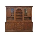 Pine kitchen cabinet the centre arch with three shaped shelves flanked by glazed and panelled