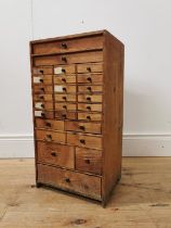 Early 20th. C. pine watch maker's drawers, the two long drawers over eighteen short drawers, four