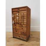 Early 20th. C. pine watch maker's drawers, the two long drawers over eighteen short drawers, four