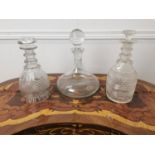 Three cut glass decanters { 24cm H & 26cm H X 2 }.